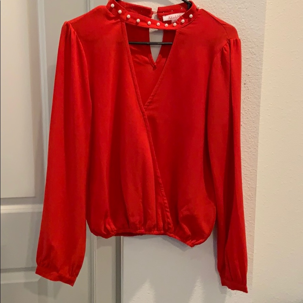 Peak neck red blouse